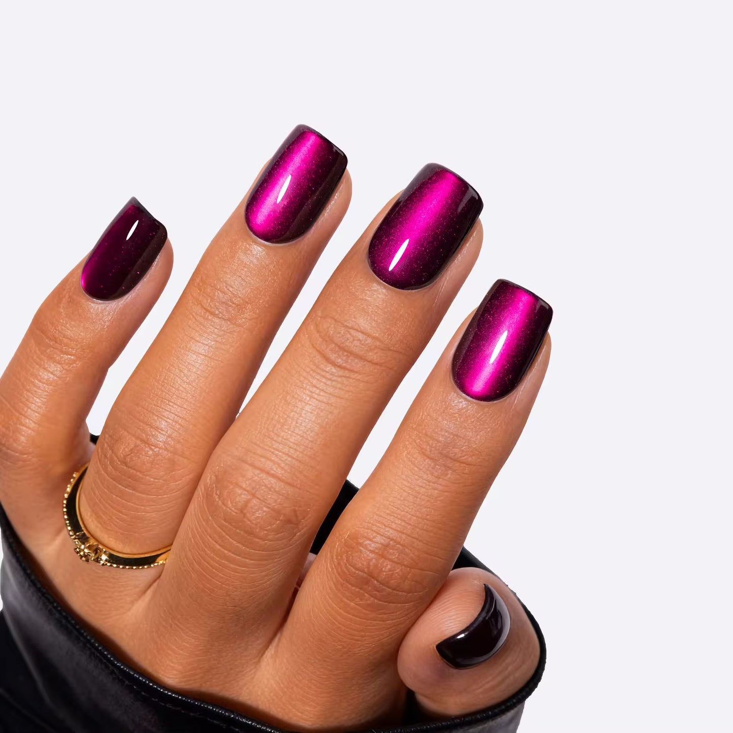 Electric Magenta Chrome press-on nails on hand