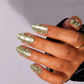 Golden Green Glow Pearls press-on nails - lifestyle hand shot