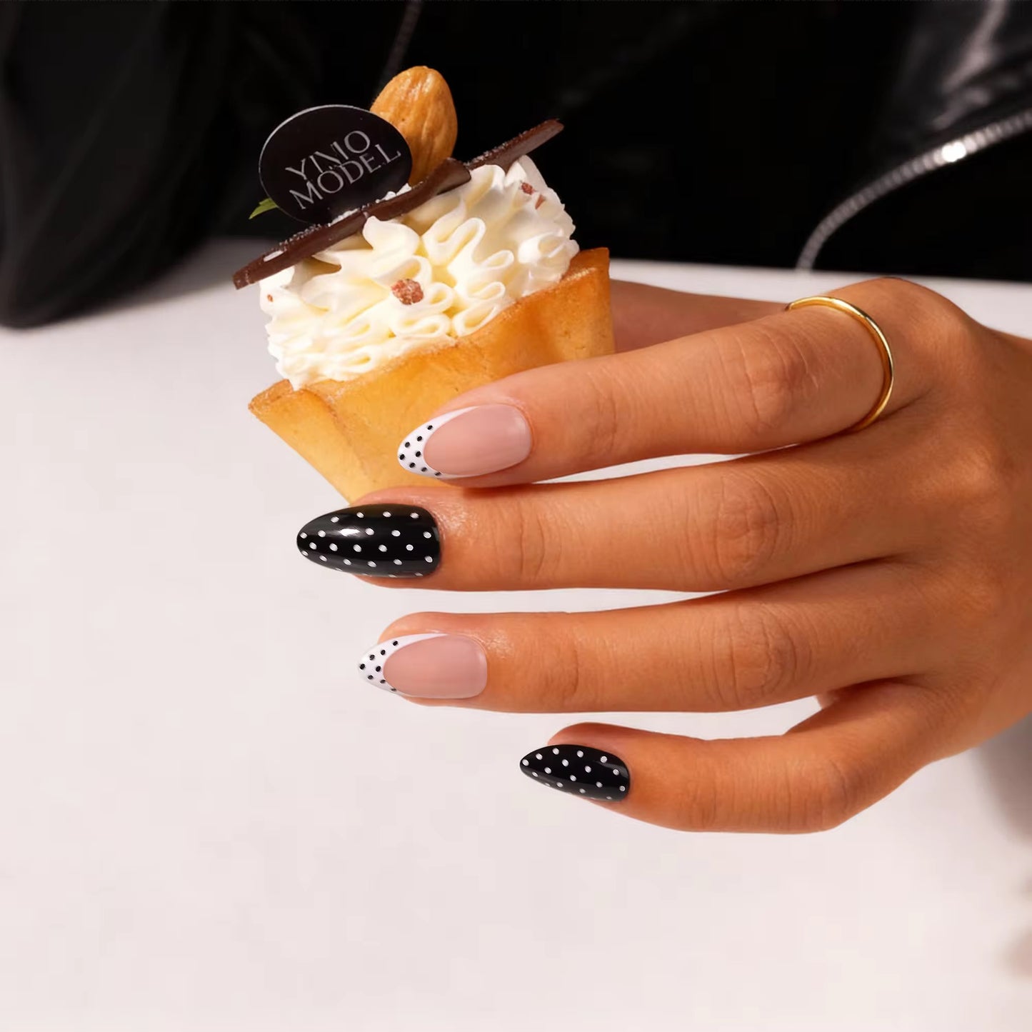 Monochrome Polka Mischief press-on nails - lifestyle hand shot