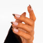 Tortoiseshell French Almond nails worn on hand